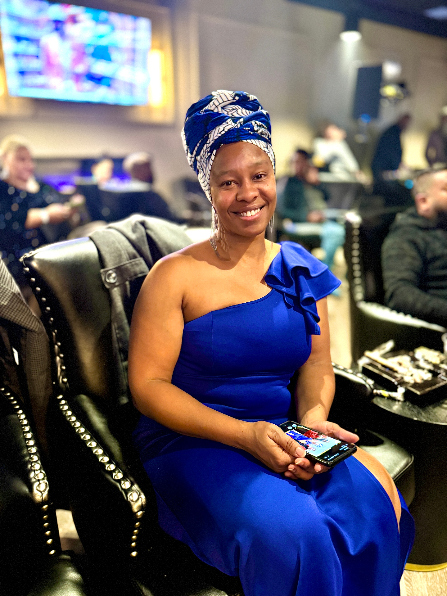 An elegant guest seated in the lounge